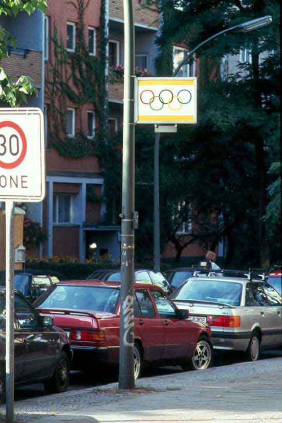 text on the back: Anti-Semitic signs in Berlin are being temporarily removed for the 1936 Olympic Games.